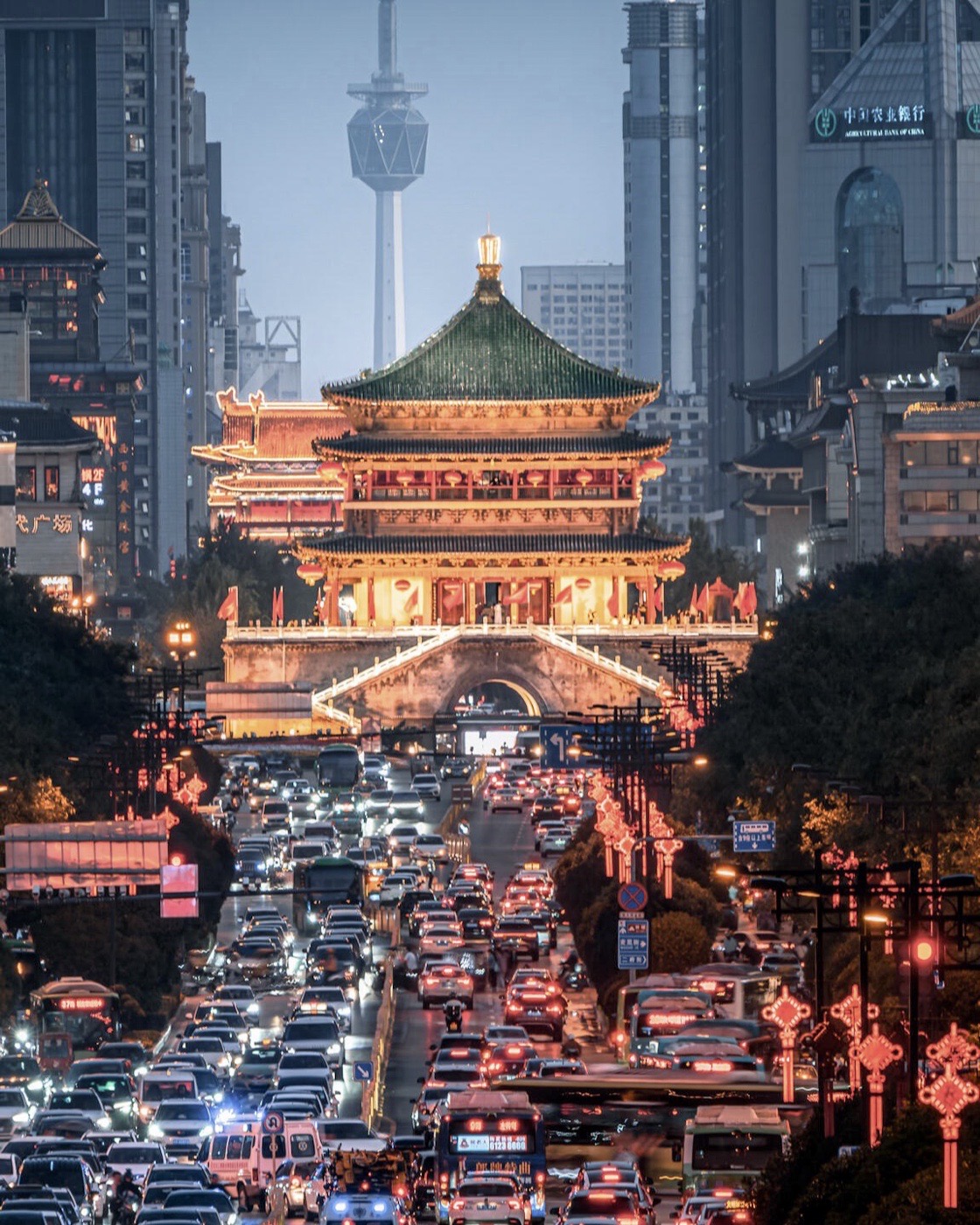 Traffic passes beneath Xi’an’s illuminated Bell Tower in the modern city